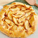 A pie with Fresh Royal Gala Apples on top.