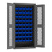 A Durham  metal storage cabinet with blue bins on the shelves.