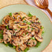 A plate of Silver Dollar mushrooms with cheese and parsley.