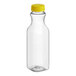 A clear plastic carafe juice bottle with a yellow lid.