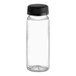 A clear plastic 4 oz. PET juice bottle with a black plastic cap.