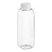 A clear plastic square juice bottle with a white cap.