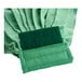 A green microfiber cloth with a green mop head.