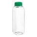 A clear plastic square juice bottle with a green cap.