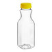 A clear plastic square carafe juice bottle with a yellow cap.