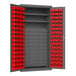 A metal storage cabinet with red bins on shelves.