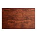 A rectangular wooden table top with a mahogany finish.