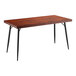 A brown Lancaster Table & Seating butcher block table with black legs.