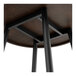A Lancaster Table & Seating round butcher block table with metal support.