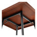 A Lancaster Table & Seating butcher block table with metal legs.