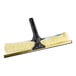 An Ettore yellow and black squeegee with a black handle.