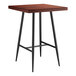A Lancaster Table & Seating Mid-Century bar table with black legs and a mahogany top.