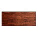 A rectangular wooden table surface with a mahogany finish.