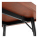 A Lancaster Table & Seating butcher block table with metal legs.