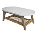 An oval white table top on a wicker basket with a white base.