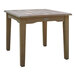 An Outdoor Interiors square eucalyptus wood table with legs.