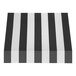 A black rectangular object with a white background and black and white striped fabric on top.