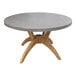 An Outdoor Interiors round teak table with a wooden base.