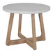An ivory round table with wooden legs.