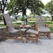 An Outdoor Interiors teak and nautical rope ottoman on a patio.