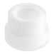 A white plastic Estella bushing with a hole and a round center.
