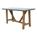 An Outdoor Interiors teak and composite counter height dining table with wooden legs.