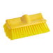 A yellow Lavex bi-level scrub brush head.