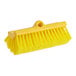 A Lavex yellow bi-level scrub brush head with bristles.