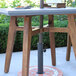 An Outdoor Interiors square dining table with a plate of food on it.