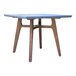 An Outdoor Interiors square table with a grey top and wooden legs.