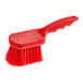 A Lavex red polyester utility brush with a handle.