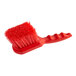 A close-up of a red Lavex floating utility and pot scrub brush with a handle.