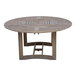 An Outdoor Interiors round wooden table with a circular design on a patio.