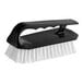 A Lavex black and white iron scrub brush with a white handle.
