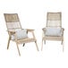 An Outdoor Interiors Teak and Wicker Bohemian Basket Lounger with a white pillow on it.