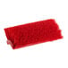 A close-up of a Lavex red bi-level scrub brush head with bristles.