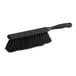 A close-up of a black Lavex counter brush with a handle.