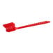 A close-up of a Lavex red utility and pot scrub brush with a handle.