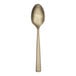 A Reserve by Libbey Santorini gold demitasse spoon with a white background.