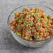 A bowl of Nerds Gummy Clusters on a table.