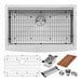 A white kitchen counter with a Ruvati stainless steel farmhouse sink, metal grid, and cutting board.
