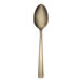 A Reserve by Libbey stainless steel teaspoon with a gold handle on a white background.