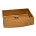 A matte copper tone stainless steel farmhouse sink with a square bowl.
