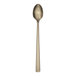 A Reserve by Libbey Santorini gold iced tea spoon with a long handle and a gold finish.