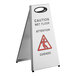 A white stainless steel wet floor sign with a red triangle and black text reading "Caution Wet Floor" on it.