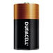 A close up of a black and gold Duracell Coppertop battery container with white text.