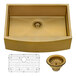 A close-up of a Ruvati Terraza stainless steel farmhouse sink in a gold brass tone with a grid in the bottom.