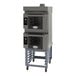 A black and grey Cadco Bakerlux double stacked countertop convection oven on a stand with wheels.