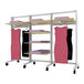 A white Udizine retail clothing display rack with shelves and pink dresses on faceouts.