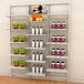 A white Udizine retail clothing display with shelves holding various types of food.